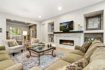 Great room with modern fireplace and custom built ins for audio/visual