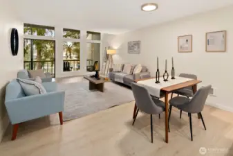 Dining area and living room enjoy a view of the lake.