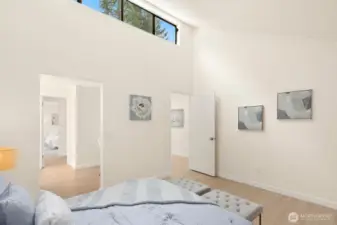 Bedroom #2 features vaulted ceilings and views of the pond.  Shared access to full bathroom.