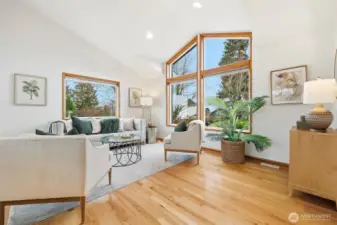 Formal living room with vaulted ceilings
