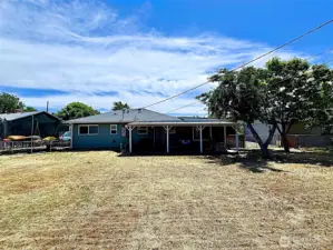 Back view of home with covered patio area