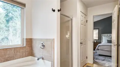 Two closets in primary bathroom, one is a walk in!