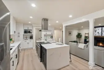 Open-concept kitchen design with custom cabinetry and seamless transition to family room.