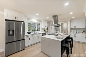 Kitchen featuring quartz countertops, modern fixtures, and generous prep space.