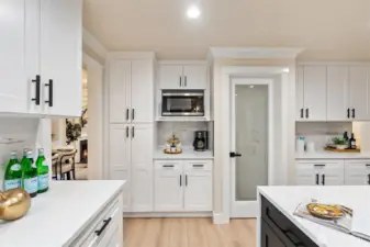 Custom kitchen cabinetry with built-in wall oven and abundant storage.