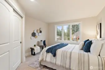 Secondary bedroom with soft natural light and neutral palette.