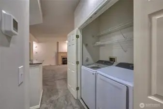 In unit laundry room with newer washer and dryer.