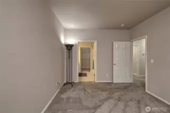 Primary bedroom view of primary bath entrance.