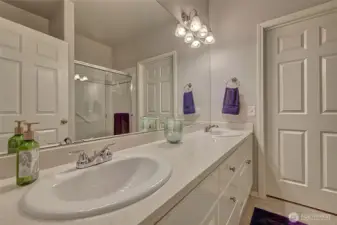 Primary bath with double vanity and lots of storage.