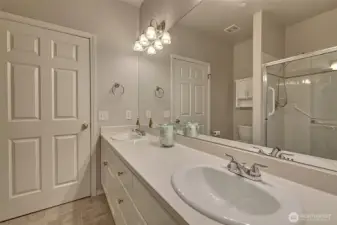 Another view of primary bath with large custom fit mirrors.