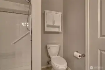 Primary bath with grab bar in shower.