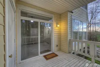 view from stairs showing additional storage closet off the deck.