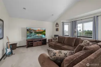 Upstairs You're Treated with Glimpses of Penn Cove and The Olympic Mountains.