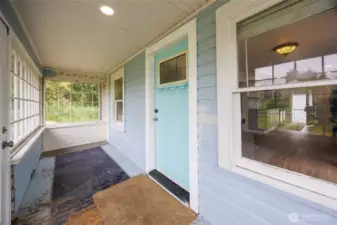 Front door with entrance through sun porch