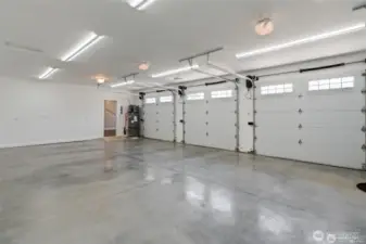 Large 3-car attached garage that is insulated, drywalled, and painted.
