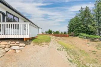 Back yard has 2 levels. More space below to plant additional grass, garden beds or possibly a pool?