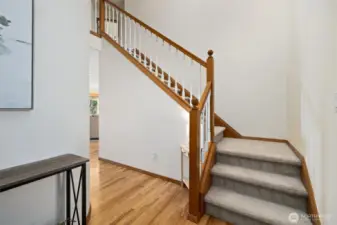 Grand entry to the upstairs walkway that has 4 options for bedrooms & 2 separate bathrooms.