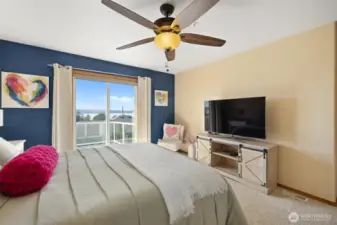 Primary bedroom w/private VIEW deck, 5 piece ensuite & custom walk-in closet.