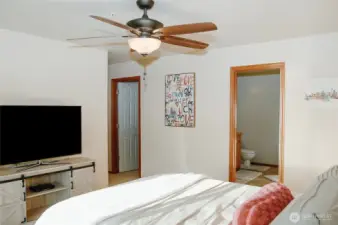Primary bedroom looking towards your custom walk-in closet & 5 piece ensuite bathroom w/double vanity & jetted bathtub.