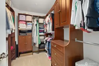 Primary suite walk-in closet w/custom built-ins.