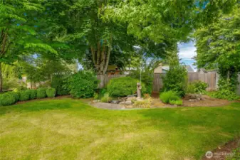Backyard with pond and garden shed