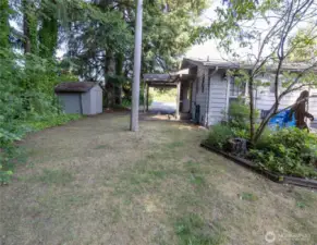 on the north side of unit A next to the carport is an outbuilding, great for storage!