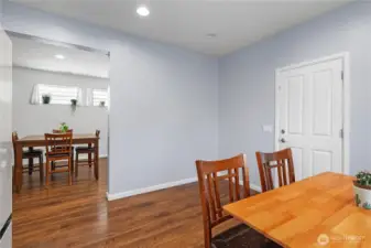 In the kitchen looking into the dining area, with the door to the double car garage on your right.