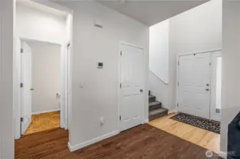 View of convenient 1/2 bath and stairs in living area.