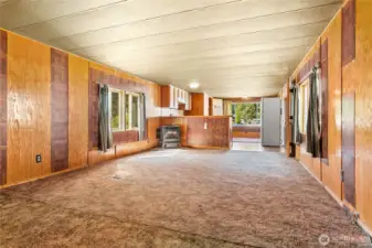 Extremely large living room. At one time half of it was a second bedroom. It could be converted back? Pellet stove included.