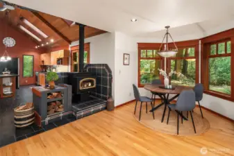 Dining area with wood stove for embracing warmth in the winter.