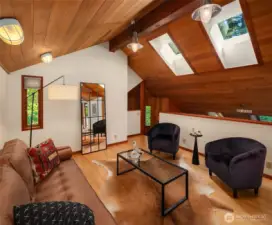 Loft above kitchen connects to second floor bedroom area too-- a perch from which to work or play!