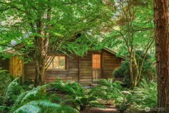 This charming building is an authentic timber-frame construction detached studio.