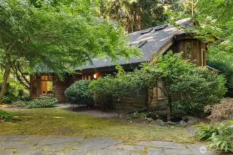 Lovely stone patio on the south side with easy access to the kitchen for al fresco meals on hot summer days.