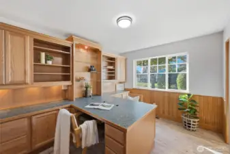 Two additional bedrooms provide flexibility for guests, hobbies, or a home office — including one already outfitted with built-in cabinetry.