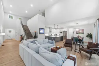 Soaring ceilings and many windows bathe the home in natural light.