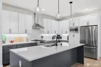 Pull up a stool or chair to the island for casual easy dining and entertaining. There is pantry space above and below the microwave.