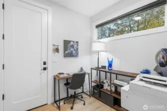 This "mud room" is being used as a home office; the door leads to the garage.