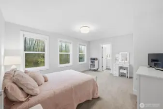 Shown is a full-sized bed, this room could easily accommodate a queen-sized bed.