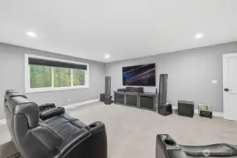 The theatre has a Dolby Atmos speaker system - 4 are in the wall and 4 are in the ceiling offering a seamless look.