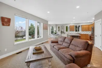 Living area with door and access to back yard and patio