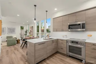 Open-concept living at its best. Entertain easily or wind down in peace—all surrounded by warmth, light, and intentional flow from kitchen to living to dining.
