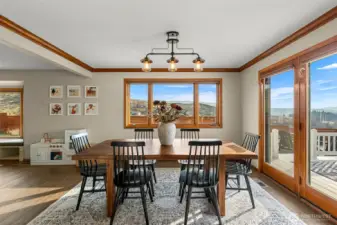 Dining with french doors to deck, patio private view yards.