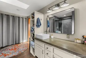 Walk in shower with tiles floors expansive vanity.