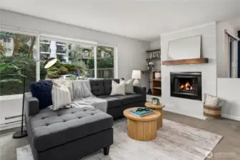 Sunken living room with wood burning fireplace and bar