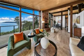 Living room on the main floor with floor to ceiling windows