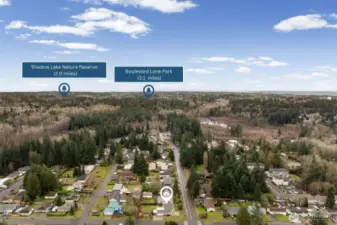 Aerial view highlights nearby outdoor recreation including Shadow Lake Nature Preserve and Boulevard Lane Park, both just minutes away. Enjoy easy access to scenic trails, green space, and natural surroundings right in the neighborhood.