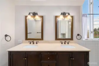 Double sinks in Primary bedroom picture window opens to Commencement Bay views