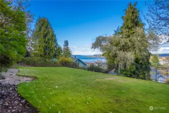 This lawn is accessed from the patio and is a safe, lovely play space overlooking the Bay.