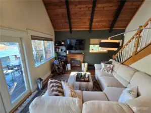 Living room has stunning views from every seat. French doors lead to your sizable deck.