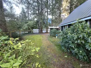 Upriver side yard offers additional fenced usable space.